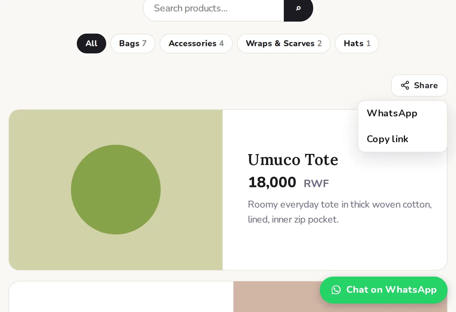 A shop page with its Share menu open, offering WhatsApp or Copy link.